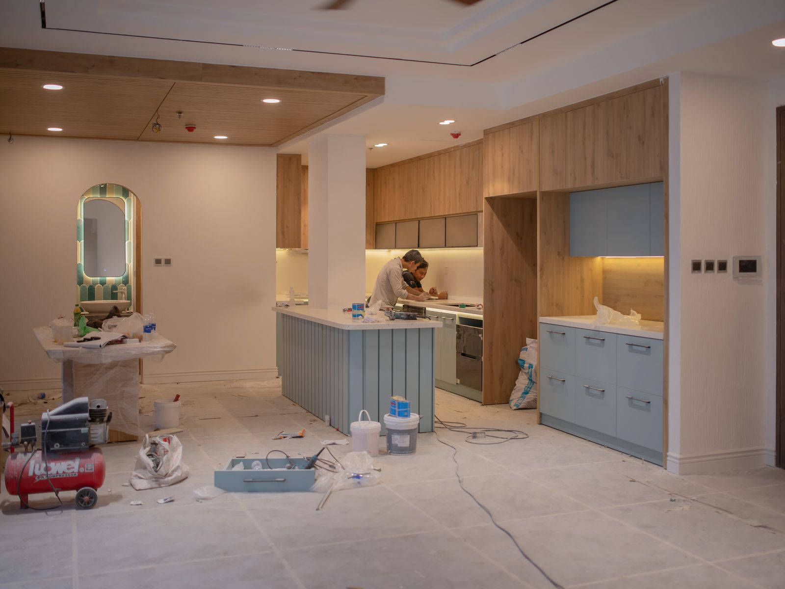 Men Working Inside a House Under Repairs