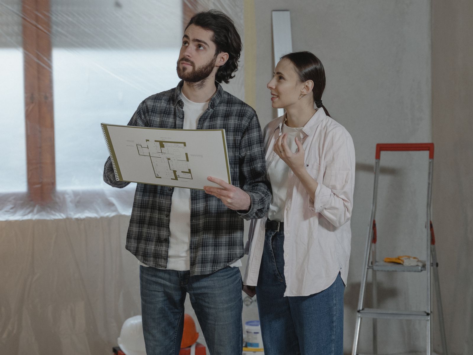 Couple Reviewing a Home Under Construction